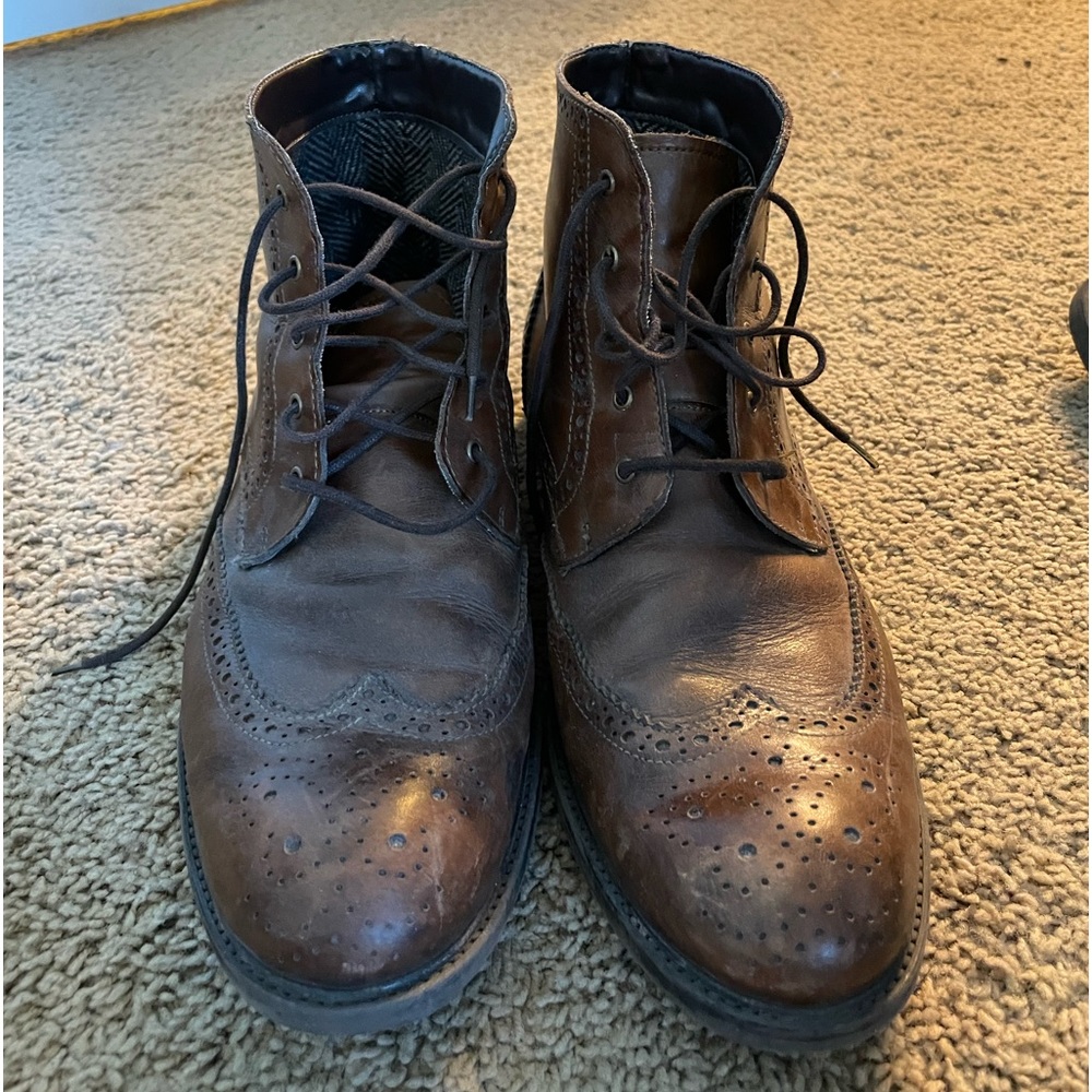 Men’s leather wingtip dress boots.